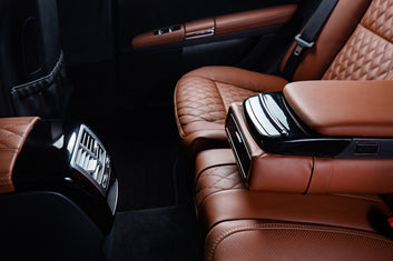 //elitegoodss.com/cdn/shop/files/luxury-car-interior-brown-black-colors.jpg?v=1729084253&width=353